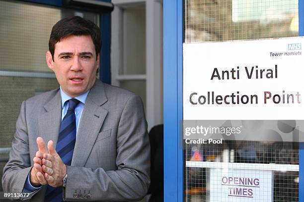 Health Secretary, Andy Burnham rubs disinfectant gel onto his hands after visiting an anti-viral clinic in Tower Hamlets on July 20, 2009 in London,...