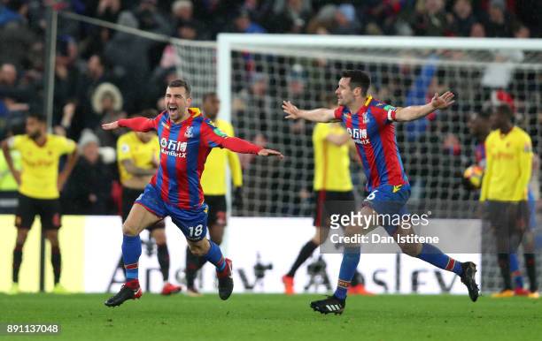 James McArthur of Crystal Palace celebrates after scoring his sides second goal with teammate Scott Dann during the Premier League match between...