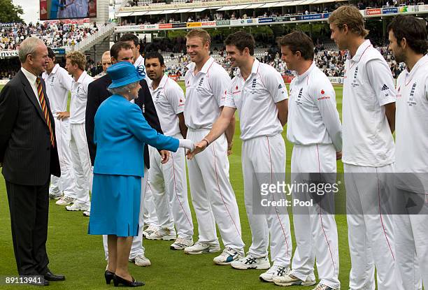 Queen Elizabeth II is introduced to the England team and shakes hands with James Anderson during day two of the npower 2nd Ashes Test Match between...