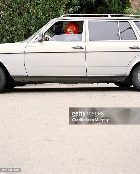 clown driving white car, side view - joker stock pictures, royalty-free photos & images