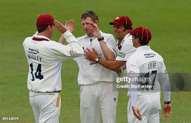 Northamptonshire bowler David Lucas is congratulated by team mates after taking his 5th wicket during day one of the LV County Championship Division...