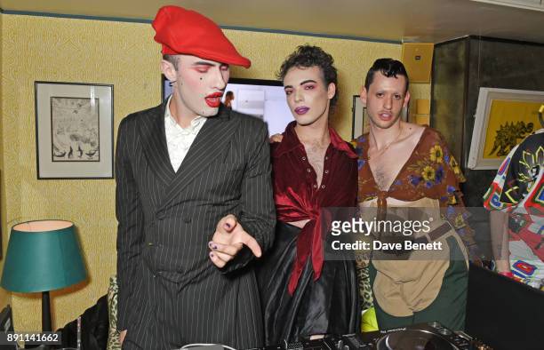 Charles Jeffrey, Harry Charlesworth and Scotty Sussman attend the Love x Chaos x Poppy Delevingne x Moet Christmas Party at George on December 12,...