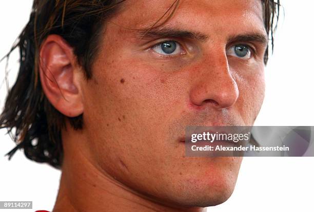 Mario Gomez of Bayern Muenchen looks on during a press conference at day three of the FC Bayern Muenchen training camp on July 20, 2009 in...