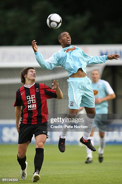 Alex Dyer of Northampton Town attempts to head the ball under pressure from Josh Simpson of Histon during the Pre-Season Friendly Match between...