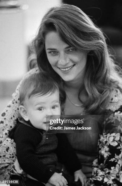 English actress Charlotte Rampling with her 8 month-old baby son Barnaby, at Heathrow Airport, London, 11th May 1973. Rampling, her son and her...