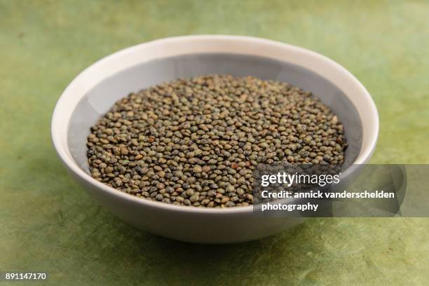 bowl of green lentils. - green lentil stock pictures, royalty-free photos & images