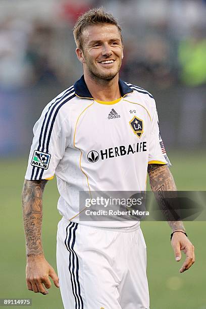 David Beckham of the Los Angeles Galaxy smiles after making a play against AC Milan during the international friendly at The Home Depot Center on...