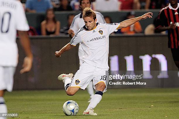 Mike Magee of the Los Angeles Galaxy takes a shot against AC Milan during the international friendly at The Home Depot Center on July 19, 2009 in...