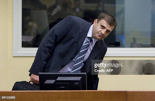 Serbian Milan Lukic enters the courtroom of the UN tribunal for former Yugoslavia in The Hague, on July 20, 2009. Two Bosnian Serb cousins were...