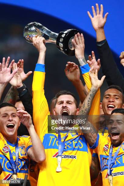 Andre Pierre Gignac of Tigres lifts the trophy to celebrate after winning the second leg of the Torneo Apertura 2017 Liga MX final between Monterrey...
