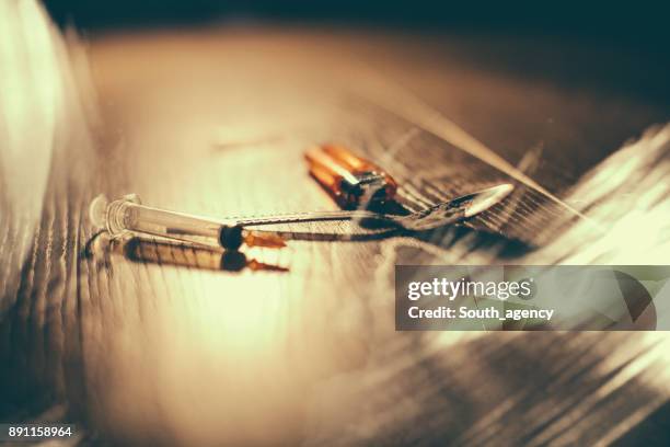 hard drugs on dark table - crack spoon stock pictures, royalty-free photos & images