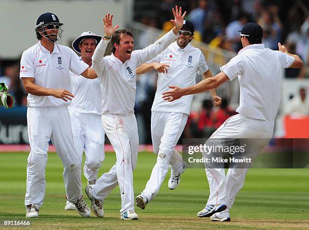 Graeme Swann of England celebrates the wicket of Mitchell Johnson of Australia with team mates during day five of the npower 2nd Ashes Test Match...