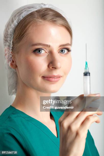 injection - nurse and portrait and white background and smiling and female and looking at camera stock pictures, royalty-free photos & images