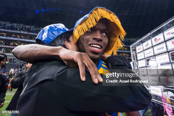 Enner Valencia of Tigres hughs his wife after winning the second leg of the Torneo Apertura 2017 Liga MX final between Monterrey and Tigres UANL at...