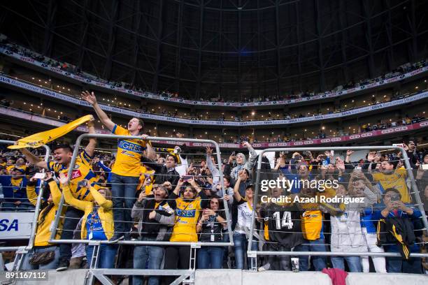 Fans of Tigres celebrate at the end of the second leg of the Torneo Apertura 2017 Liga MX final between Monterrey and Tigres UANL at BBVA Bancomer...