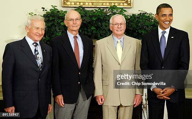 President Barack Obama hosts Apollo 11 astronauts Edwin "Buzz" Aldrin, Michael Collins and Neil Armstrong in the Oval Office at the White House July...