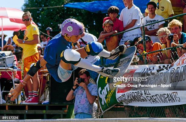 Tony Hawk, riding for Powell Peralta, does a frontside ollie above the keyhole pool during competition as the National Skateboarding Association...