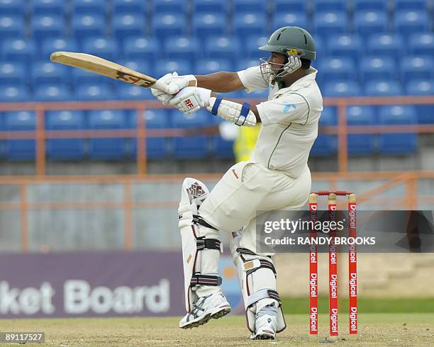 Bangladesh batsman Raqibul Hasan pulls West Indies bowler Tino Best for four runs on the fourth day of the second test match at Grenada National...