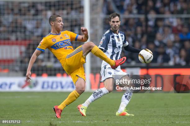 Jesus Dueñas of Tigres fights for the ball with Jose Maria Basanta of Monterrey during the second leg of the Torneo Apertura 2017 Liga MX final...