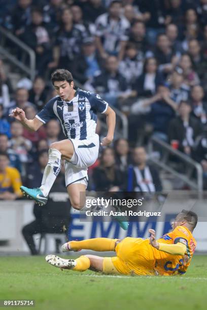 Stefan Medina of Monterrey jumps over Juninho of Tigres during the second leg of the Torneo Apertura 2017 Liga MX final between Monterrey and Tigres...