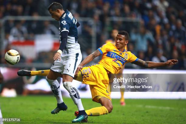 Francisco Meza of Tigres struggles for the ball with Rogelio Funes Mori of Monterrey during the second leg of the Torneo Apertura 2017 Liga MX final...