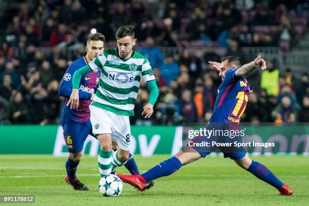 Bruno Fernandes of Sporting CP is tackled by Francisco Alcacer Garcia, Paco Alcacer , of FC Barcelona during the UEFA Champions League 2017-18 match...