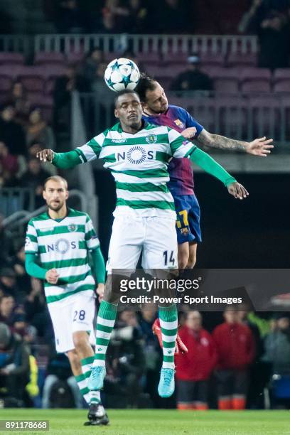 William Carvalho of Sporting CP competes for the ball with Francisco Alcacer Garcia, Paco Alcacer, of FC Barcelona during the UEFA Champions League...