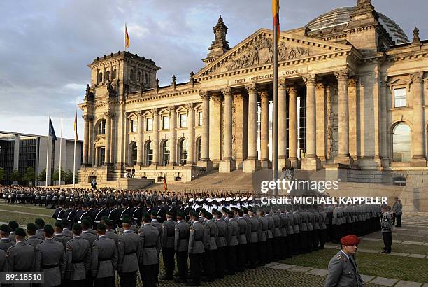 Soldiers of the 3rd and 7th "Wachbataillon" of the German Bundeswehr are sworn in during a ceremony for new recruits in front of the Reichstag...