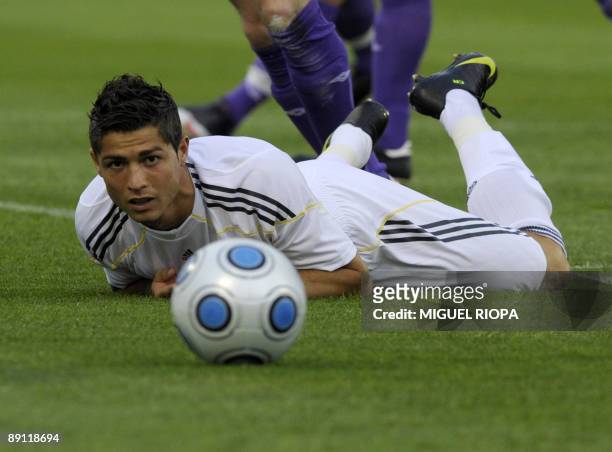 Real Madrid's player Portuguese Cristiano Ronaldo watches the ball during a friendly football match against Shamrock Rovers on July 20, 2009 at the...