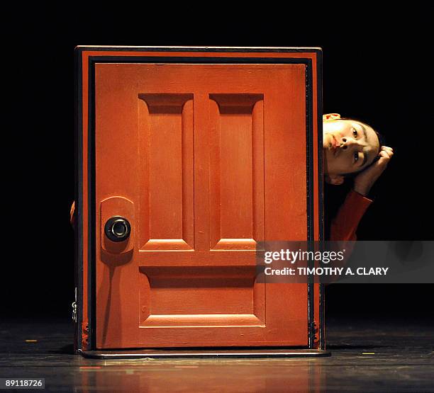 Dancer Jun Kuribayashi with the group Pilobolus performs a scene from "2b" before the opening night premiere at the Joyce Theater in New York on July...