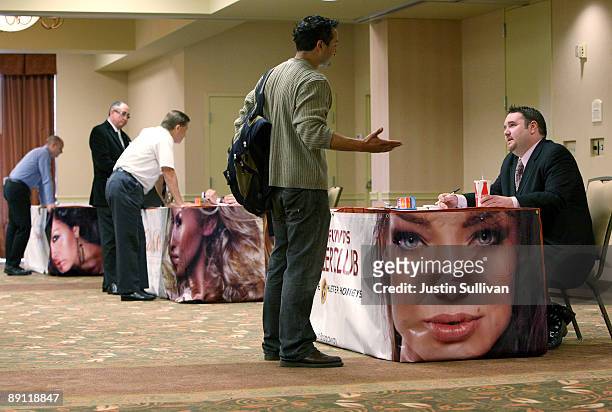 Job seekers talk with potential employers during a job fair for the adult entertainment industry July 20, 2009 in San Francisco, California. Hundreds...