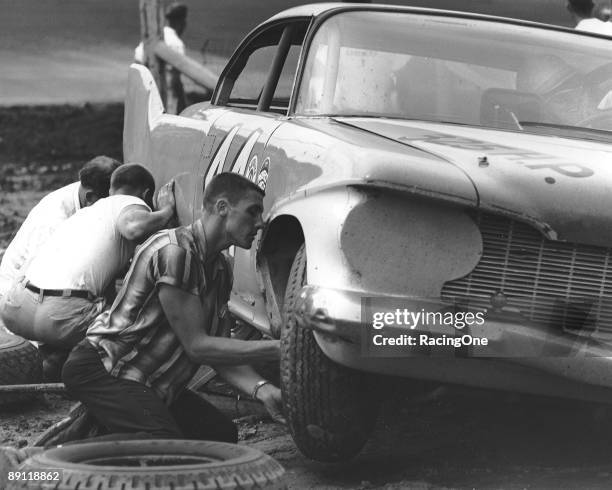 Driving one of the Petty Engineering '60 Plymouths , Jim Paschal makes a pit stop at Asheville-Weaverville Speedway during the Western North Carolina...