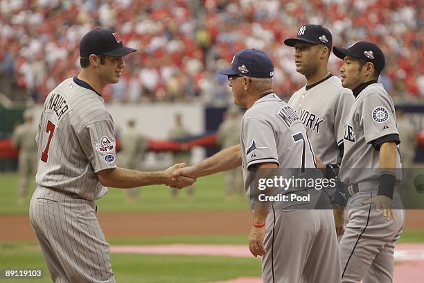 American League All-Star Joe Mauer of the Minnesota Twins greets manager Joe Madden of Tampa Bay Rays, Derek Jeter of New York Yankees and Ichiro...