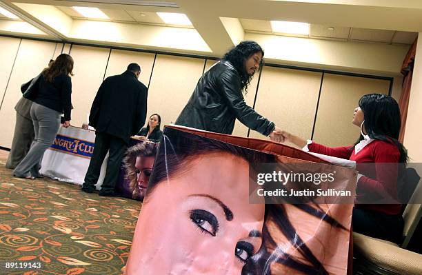 Job seekers talk with potential employers during a job fair for the adult entertainment industry July 20, 2009 in San Francisco, California. Hundreds...