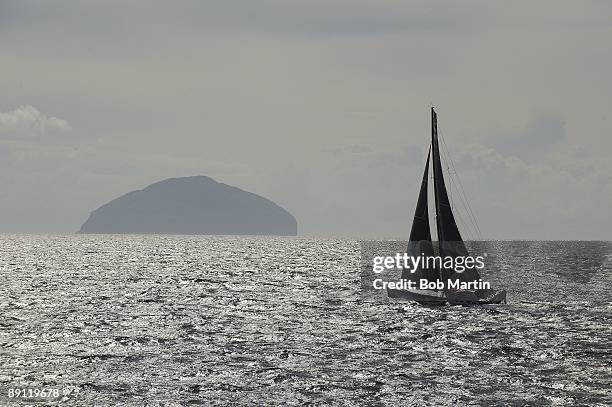 Scenic view of sail boat in water by Ailsa Craig island during Saturday play at Ailsa Course of Turnberry Resort. South Ayrshire, Scotland 7/18/2009...