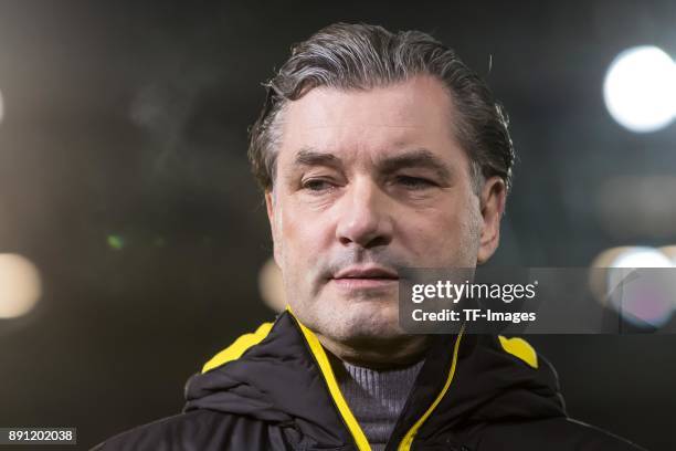 Michael Zorc of Dortmund looks on prior to the Bundesliga match between 1. FSV Mainz 05 and Borussia Dortmund at Opel Arena on December 12, 2017 in...
