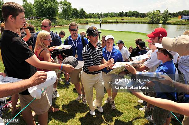 Mike Weir signs autographs for fans during the RBC Canadian Open's Mike Weir Charity Classic Pro-Am at Glen Abbey Golf Club on July 20, 2009 in...