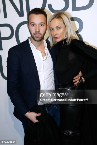 Boniface Reiffers and Melonie Foster Hennessy attend the "Solve Sundsbo pour Numero" Exhibition Opening at Studio des Acacias on December 12, 2017 in...