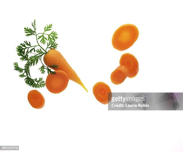 slices of baby carrot - carrot isolated stock pictures, royalty-free photos & images
