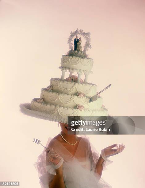 bride with wedding cake hat - wedding cakes stock pictures, royalty-free photos & images