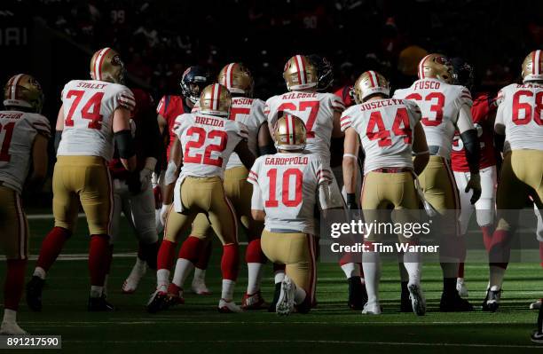 Jimmy Garoppolo of the San Francisco 49ers takes a knee on the final play of the game against the Houston Texans at NRG Stadium on December 10, 2017...