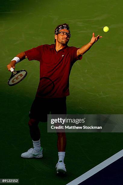 Arnaud Clement of France serves to Sam Querrey during the Indianapolis Tennis Championships on July 20, 2009 at the Indianapolis Tennis Center in...