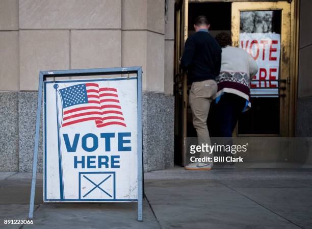 Voters enter the polling station at the Jefferson County Courthouse in Birmingham, Ala., on Tuesday, Dec. 12 to vote in the special election to fill...
