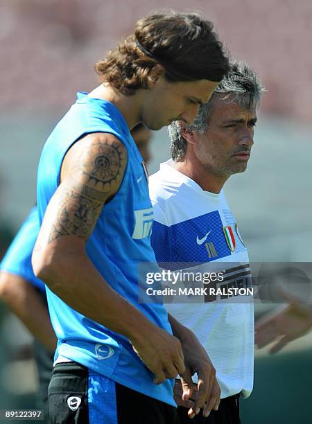 Inter Milan forward Zlatan Ibrahimovic talks with coach José Mourinho as they train at the Rose Bowl on the eve of their game against Chelsea, in Los...