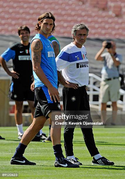 Zlatan Ibrahimovic striker of Inter Milan and coach Jose Mourinho talk as they watch team practice at the Rose Bowl stadium on July 20, 2009 in...