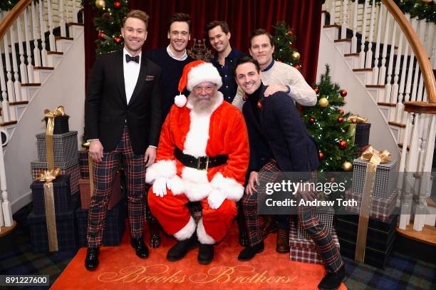 Christopher Hanke, Erich Bergen, Andrew Rannells, Michael Doyle, and Max von Essen pose with Santa as Brooks Brothers celebrates the holidays with...