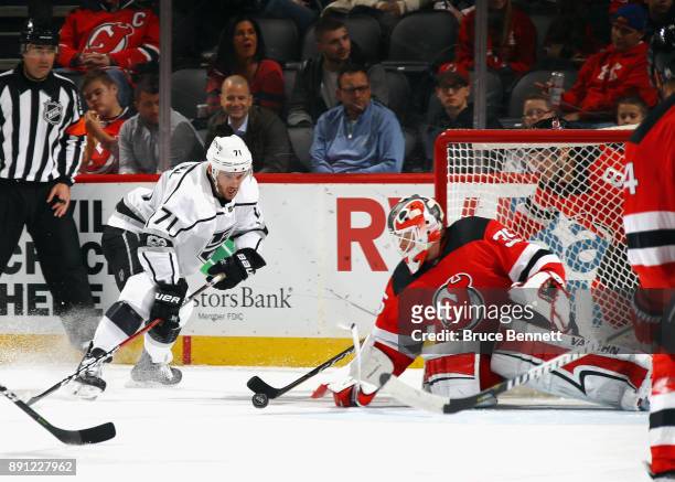 Cory Schneider of the New Jersey Devils makes the first period save on Torrey Mitchell of the Los Angeles Kings at the Prudential Center on December...