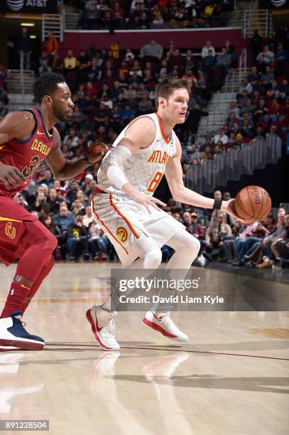 Luke Babbitt of the Atlanta Hawks handles the ball against the Cleveland Cavaliers on December 12, 2017 at Quicken Loans Arena in Cleveland, Ohio....