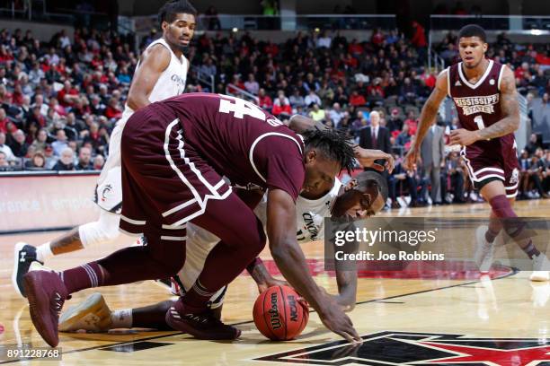 Gary Clark of the Cincinnati Bearcats fights for a loose ball against Schnider Herard of the Mississippi State Bulldogs in the first half of a game...