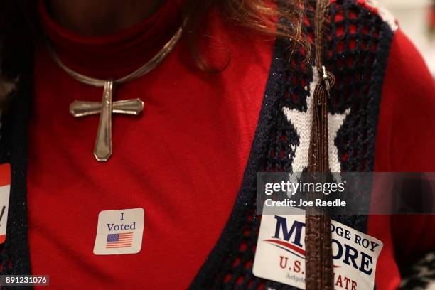 Woman wears an "I Voted" sticker as she awaits the arrival of Republican Senatorial candidate Roy Moore for his election night party in the RSA...